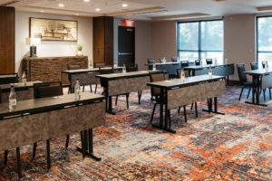 Side angle of tables set up in Revel Hotel's Meeting & Events space